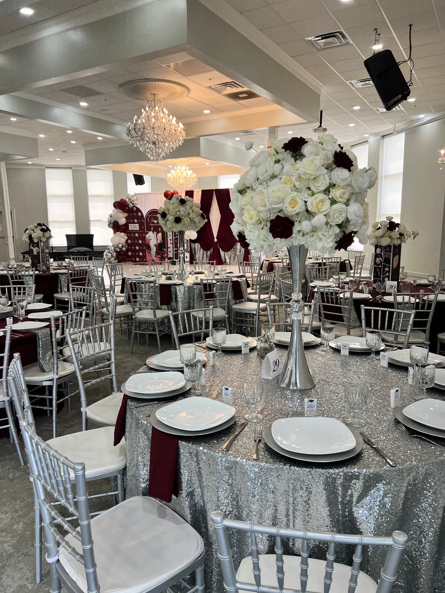 Burgundy and silver ballroom event décor by Lavish Events by Talia